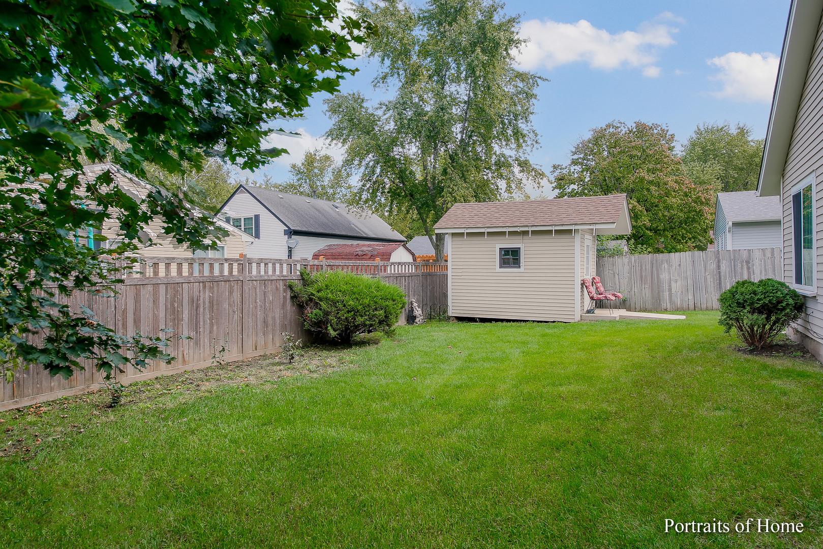 6 Shermead Road Montgomery, IL 60538 - Photo 17 of 25 a view of a backyard with potted plants and large tree