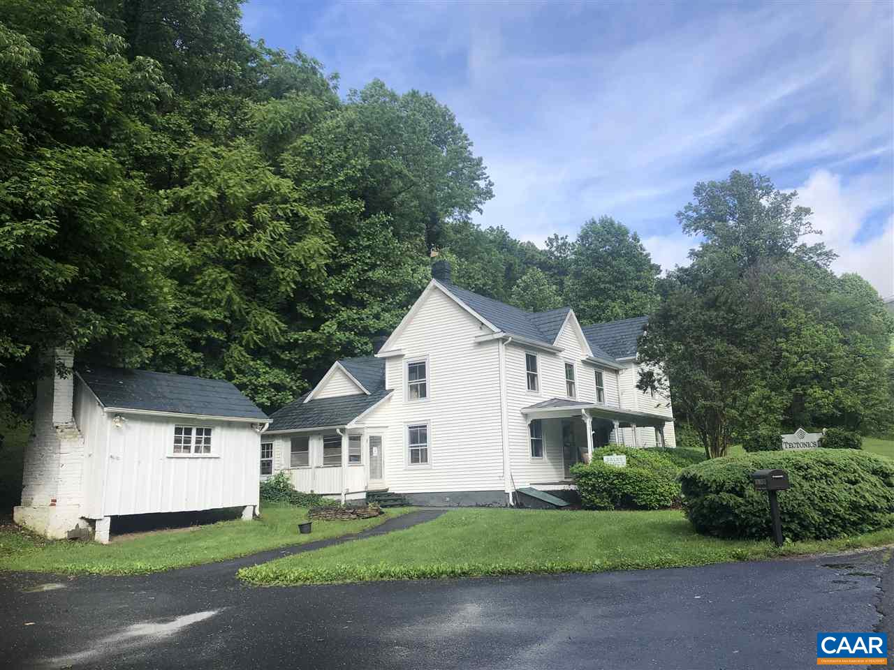 2771 Beech Grove Road Roseland, VA 22967 - Photo 1 of 31 a front view of a house with a garden and yard