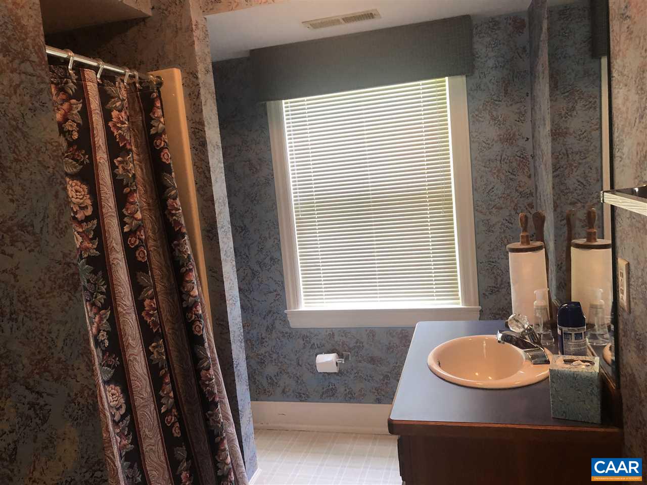 2771 Beech Grove Road Roseland, VA 22967 - Photo 12 of 31 a bathroom with a sink and a mirror