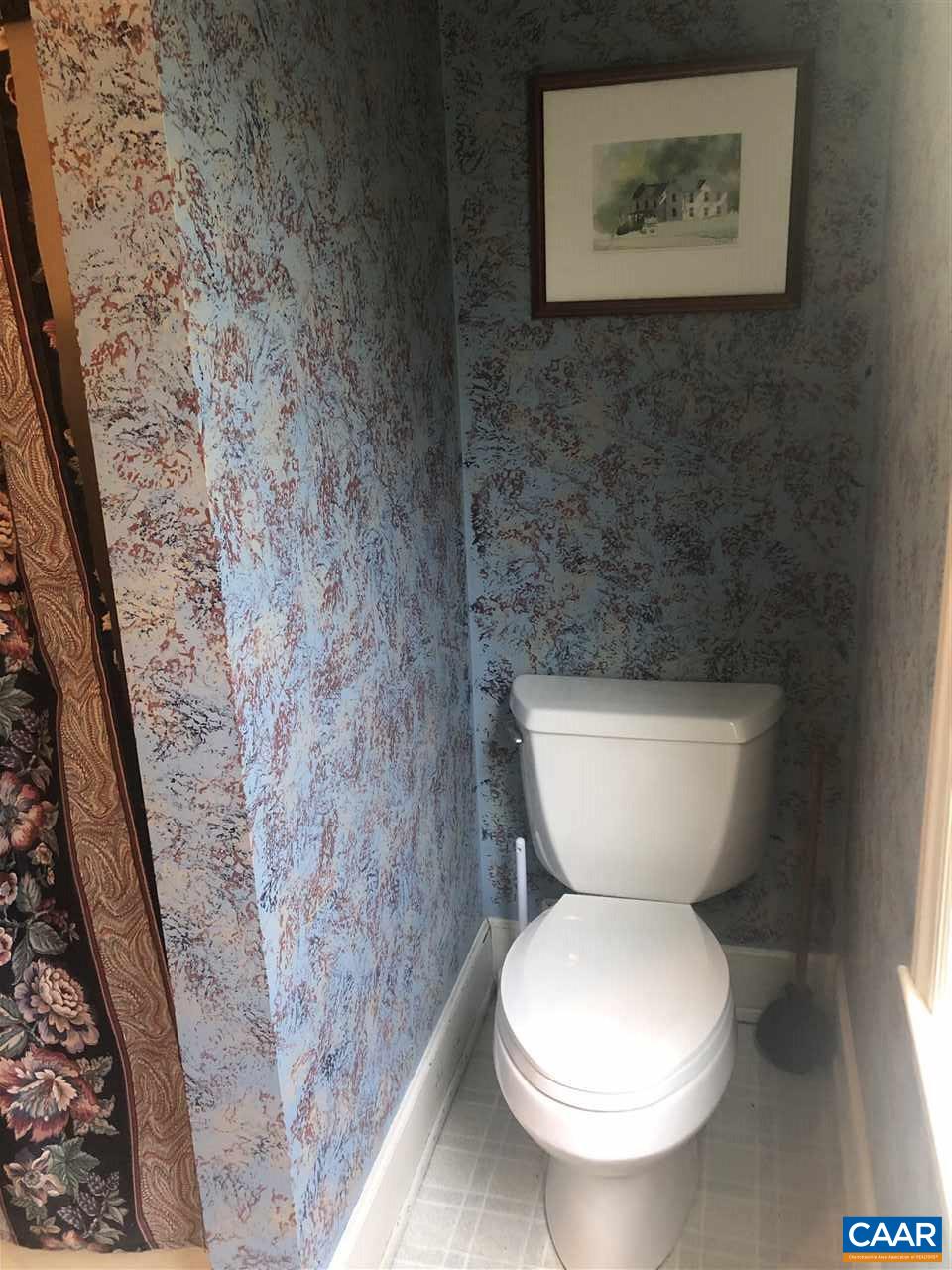 2771 Beech Grove Road Roseland, VA 22967 - Photo 14 of 31 a white toilet sitting next to a small bathroom