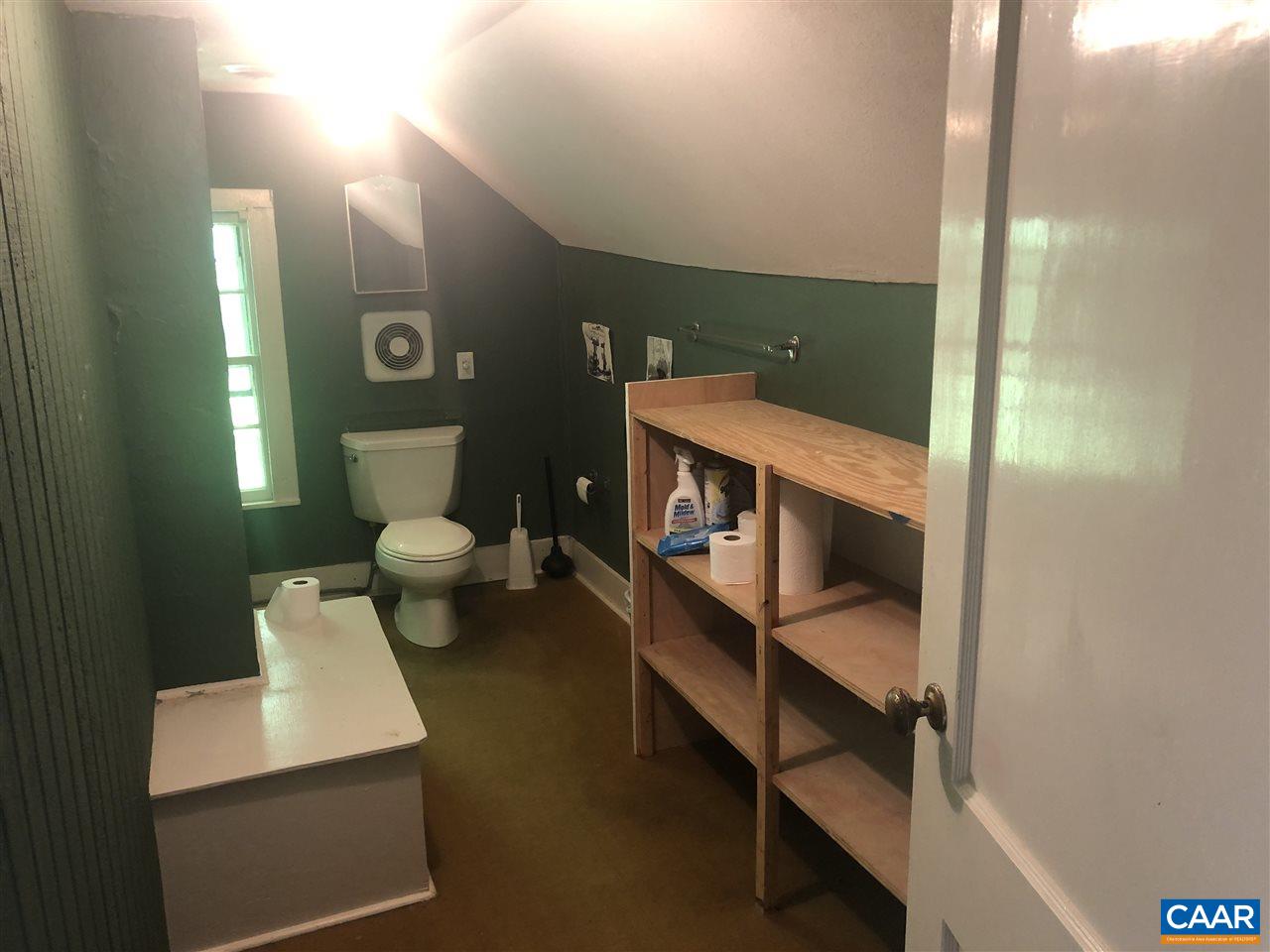 2771 Beech Grove Road Roseland, VA 22967 - Photo 24 of 31 a bathroom with a sink a toilet and mirror
