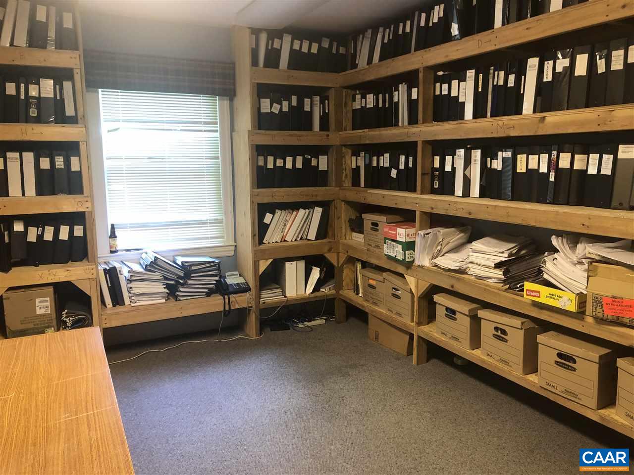 2771 Beech Grove Road Roseland, VA 22967 - Photo 27 of 31 a living room with furniture and a book shelf