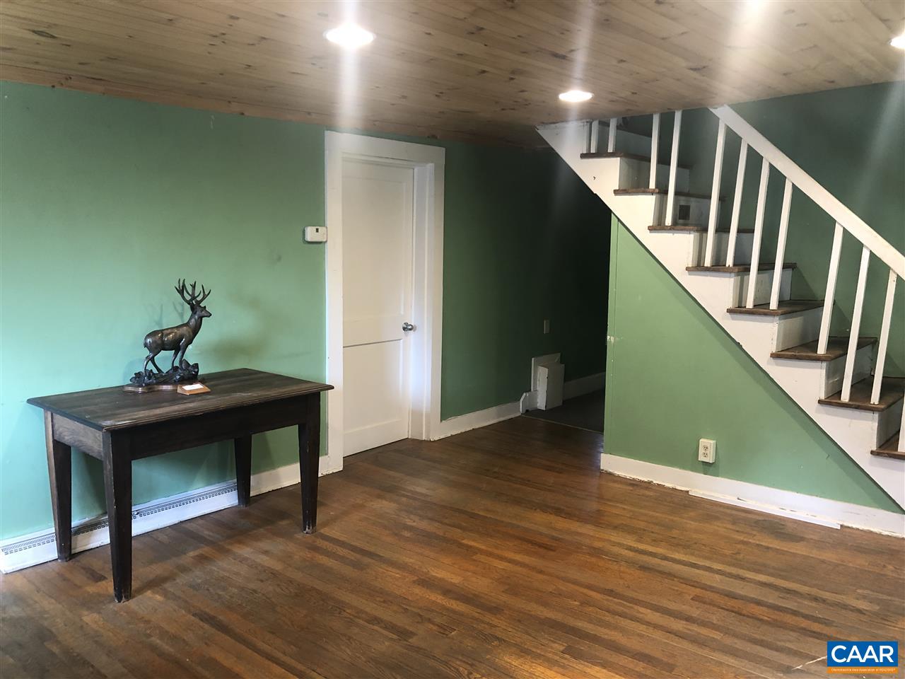 2771 Beech Grove Road Roseland, VA 22967 - Photo 4 of 31 a view of a hallway with wooden floor and stairs