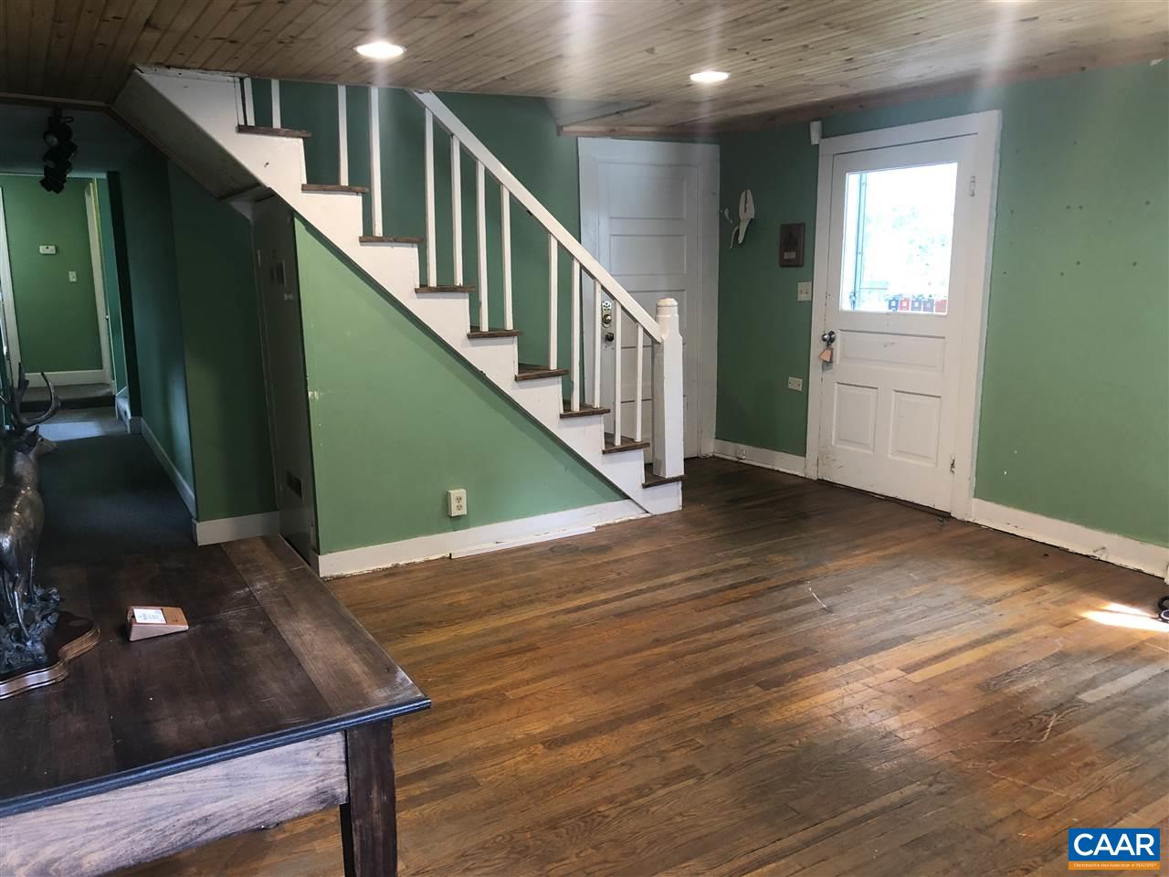 2771 Beech Grove Road Roseland, VA 22967 - Photo 6 of 31 a view of a hallway with wooden floor and stairs