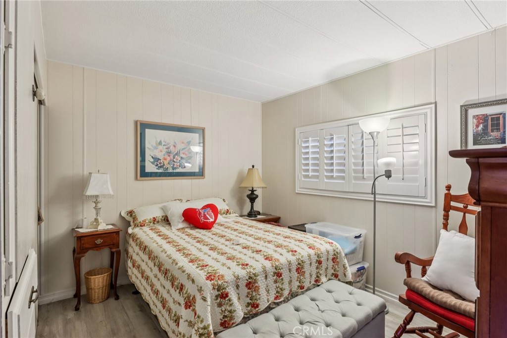 3700 Buchanan Street, Unit 28 Riverside, CA 92503 - Photo 17 of 35 a bedroom with a bed and a dresser next to a window