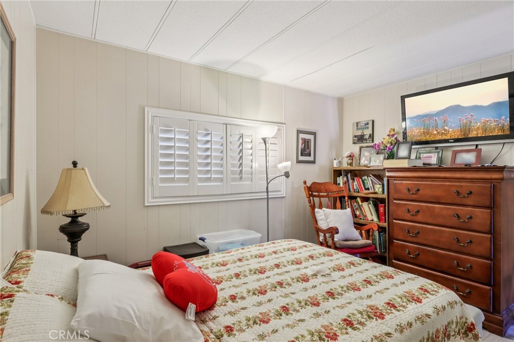 3700 Buchanan Street, Unit 28 Riverside, CA 92503 - Photo 18 of 35 a bedroom with a bed and furniture