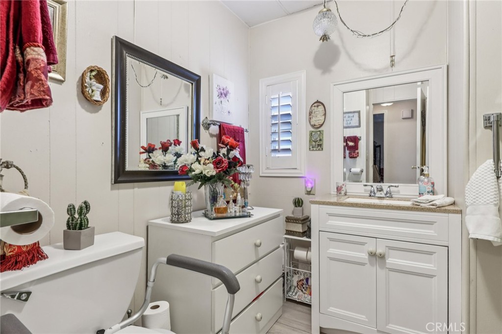 3700 Buchanan Street, Unit 28 Riverside, CA 92503 - Photo 21 of 35 a bathroom with a sink vanity and mirror