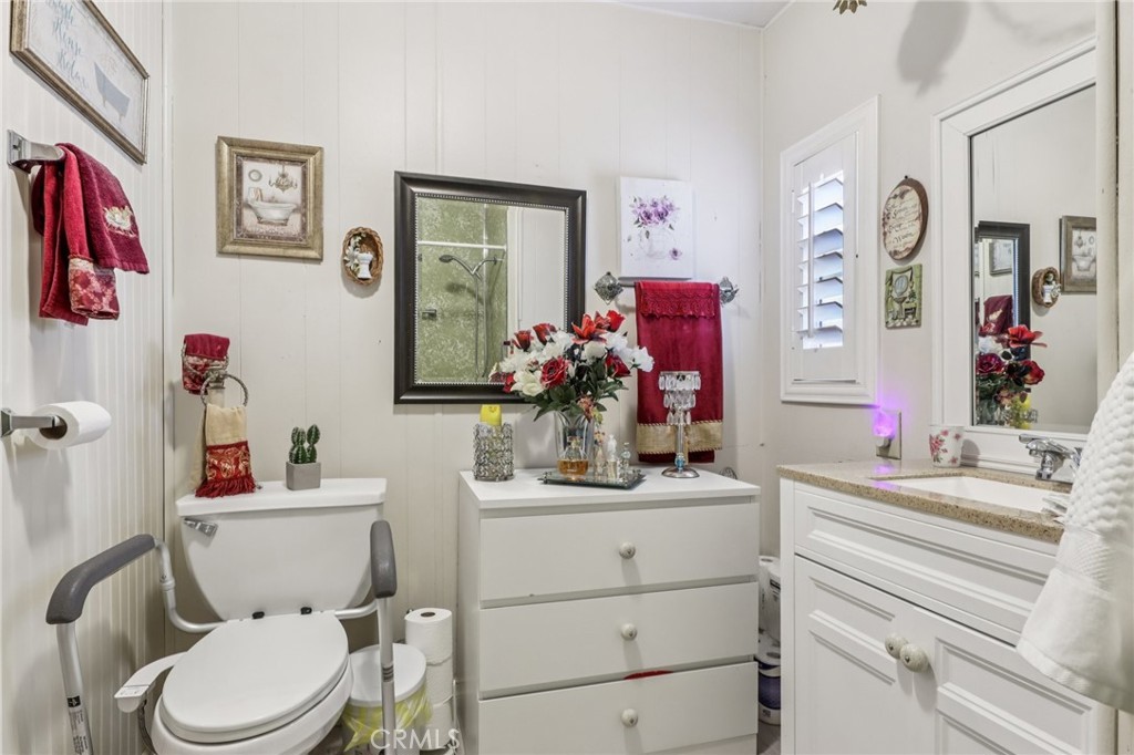 3700 Buchanan Street, Unit 28 Riverside, CA 92503 - Photo 22 of 35 a bathroom with a sink vanity mirror and toilet