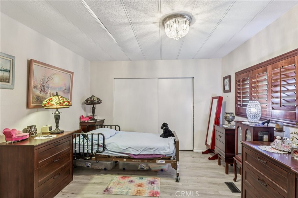 3700 Buchanan Street, Unit 28 Riverside, CA 92503 - Photo 24 of 35 a bedroom with furniture and a window