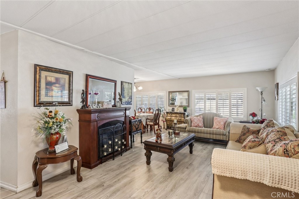 3700 Buchanan Street, Unit 28 Riverside, CA 92503 - Photo 4 of 35 a living room with furniture and a fireplace