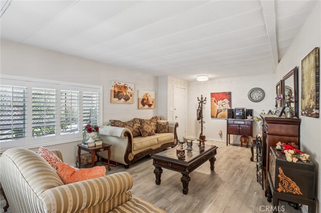 3700 Buchanan Street, Unit 28 Riverside, CA 92503 - Photo 5 of 35 a living room with furniture and a flat screen tv