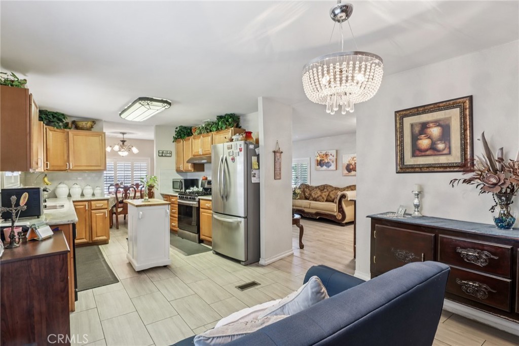 3700 Buchanan Street, Unit 28 Riverside, CA 92503 - Photo 9 of 35 a living room with furniture kitchen view and a table