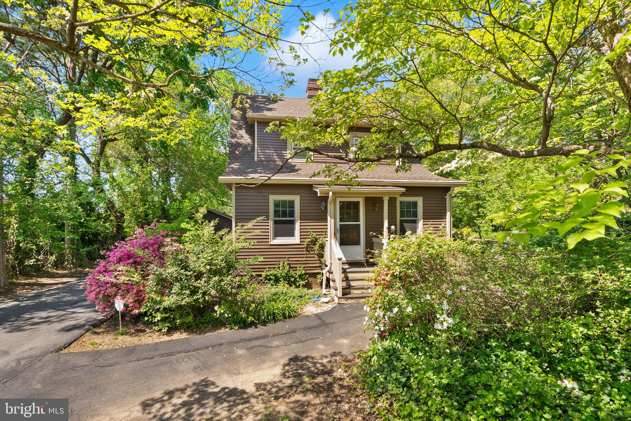 1616 Chain Bridge Road McLean, VA 22101 - Photo 14 of 28 a front view of a house with a yard