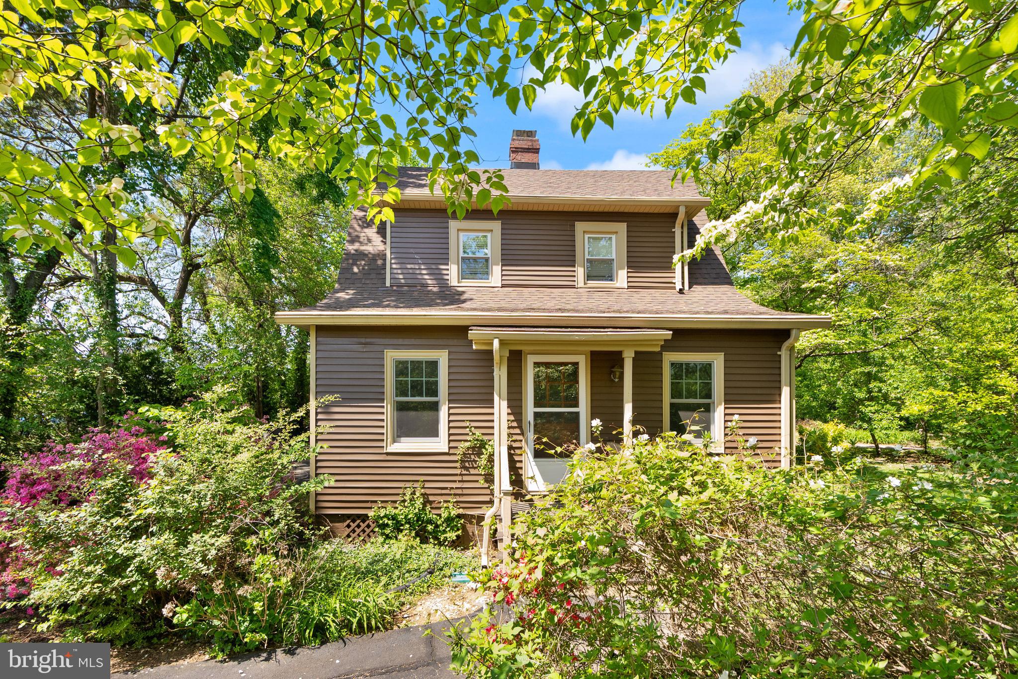 1616 Chain Bridge Road McLean, VA 22101 - Photo 15 of 28 a front view of a house with garden