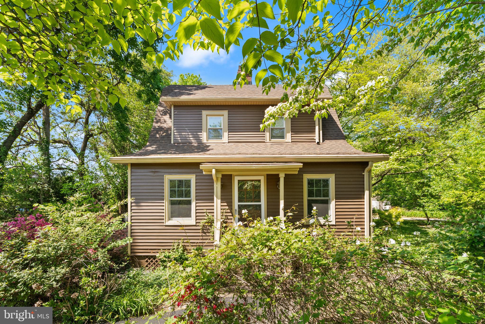 1616 Chain Bridge Road McLean, VA 22101 - Photo 2 of 28 a front view of a house with garden