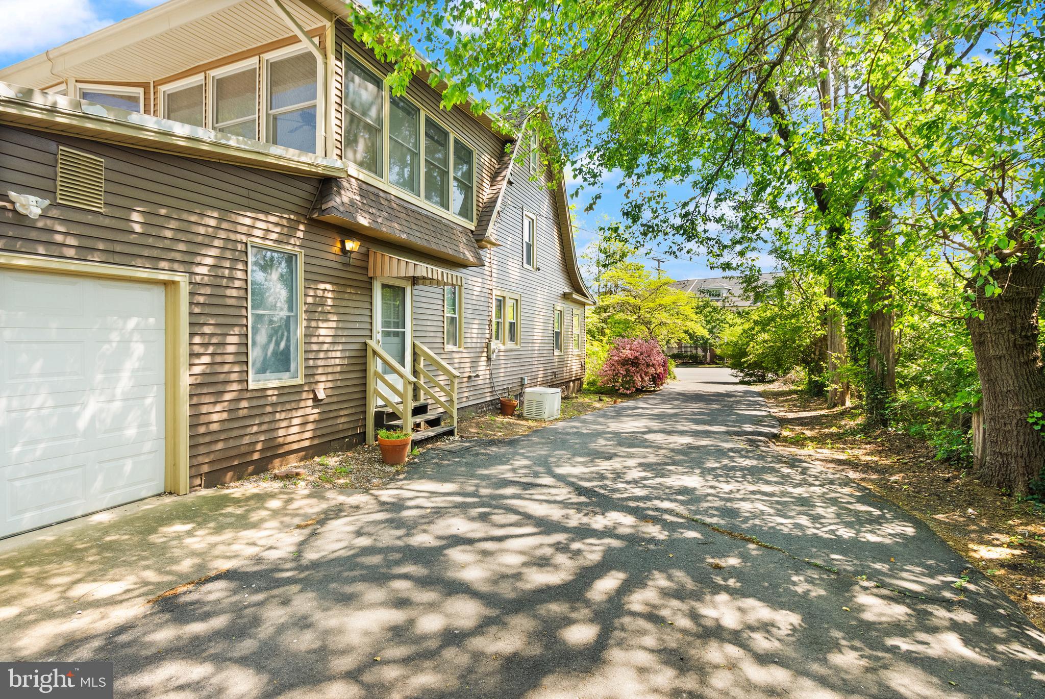 1616 Chain Bridge Road McLean, VA 22101 - Photo 5 of 28 a view of a house with backyard and sitting area