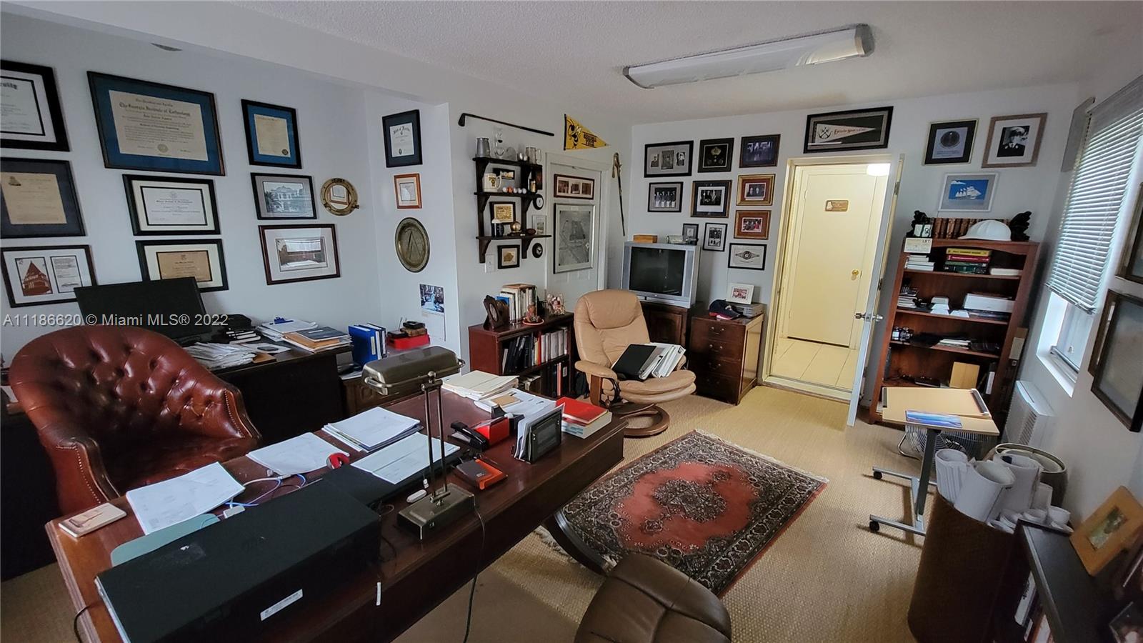 Kendall Miami, FL 33176 - Photo 12 of 15 a living room with furniture fireplace and book shelf