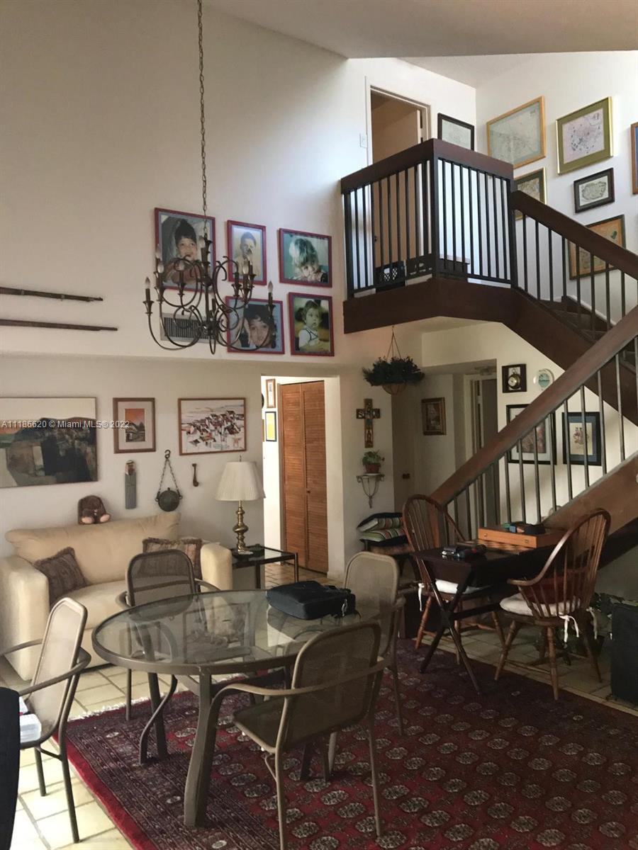 Kendall Miami, FL 33176 - Photo 9 of 15 a living room with patio furniture and a chandelier