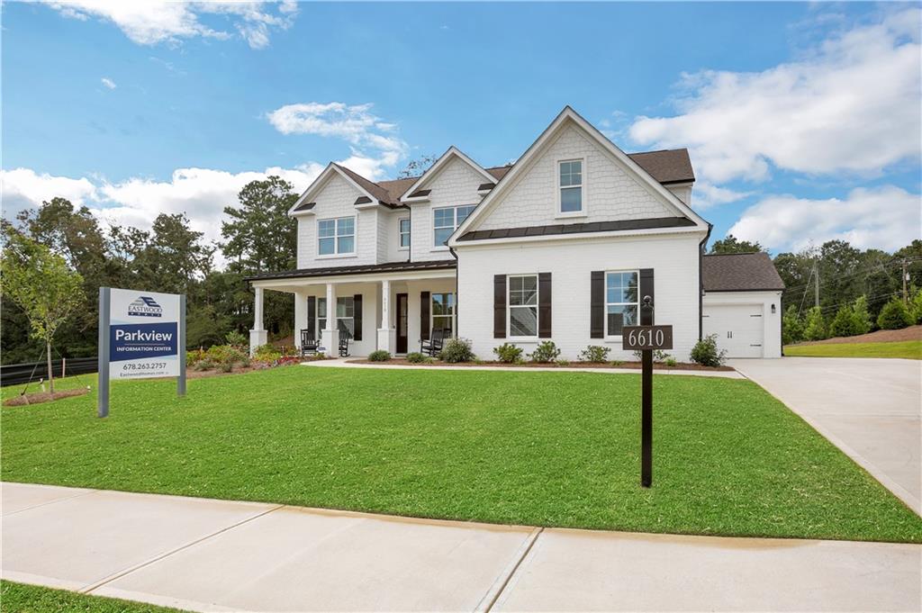 6605 Benchwood Path Cumming, GA 30028 - Photo 1 of 1 a front view of a house with a garden