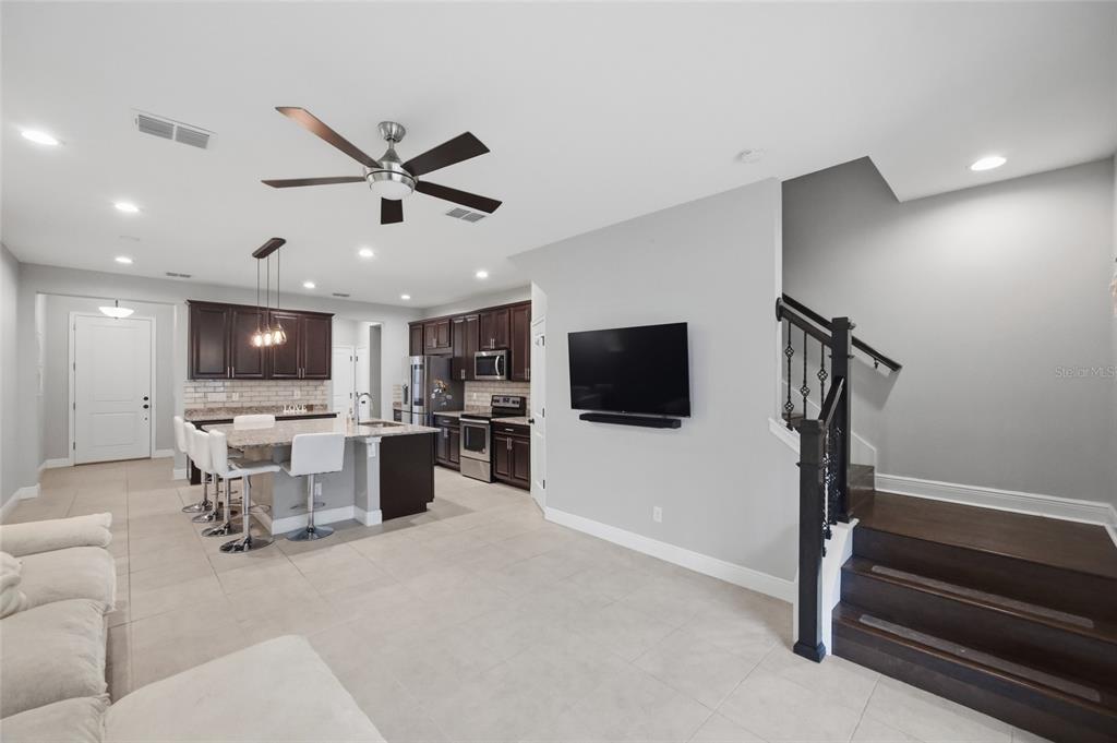 2013 Sunset Wind Loop Oldsmar, FL 34677 - Photo 12 of 43 a living room with furniture and a flat screen tv