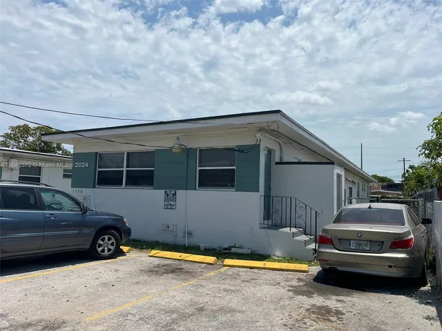 a car parked in front of a house