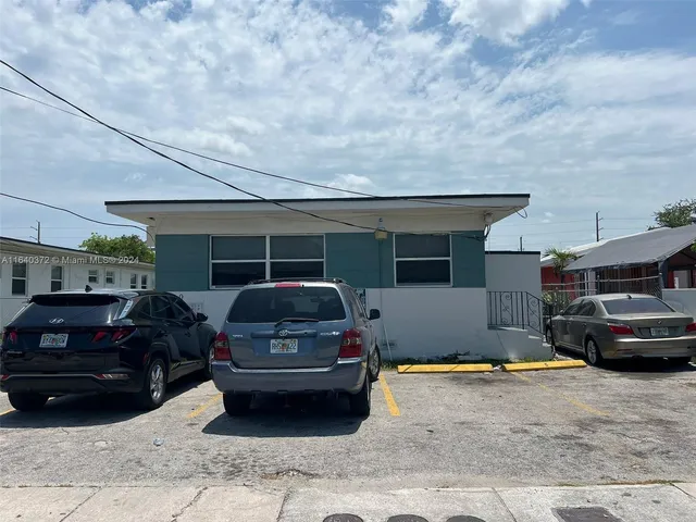 a car parked in front of a house