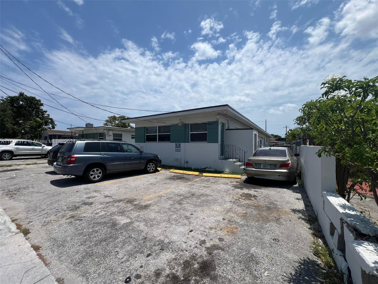 2150 Northwest 24th Street Miami, FL 33142 - Photo 6 of 18 a view of a car in garage