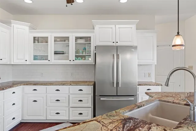 a kitchen with a sink and cabinets