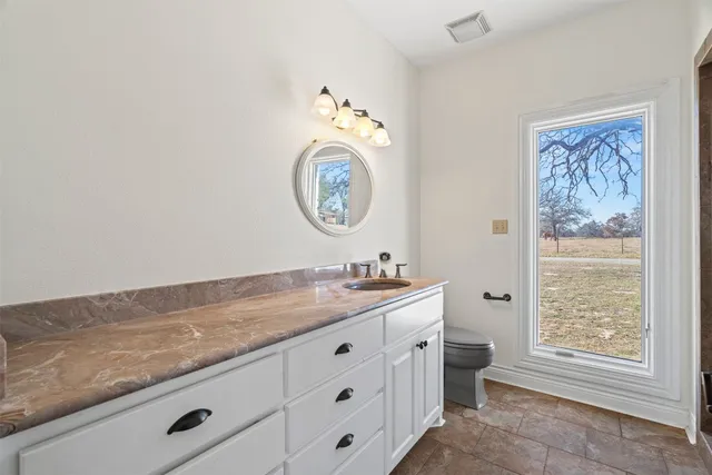 a view of bathroom with dual sinks