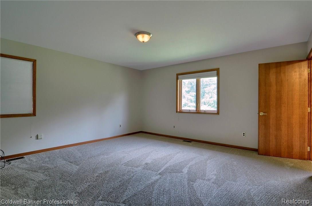 25452 Johns Road South Lyon, MI 48178 - Photo 19 of 34 018-Master_Bedroom.jpg