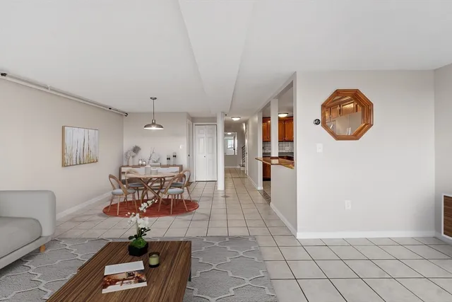 a view of kitchen with refrigerator and window
