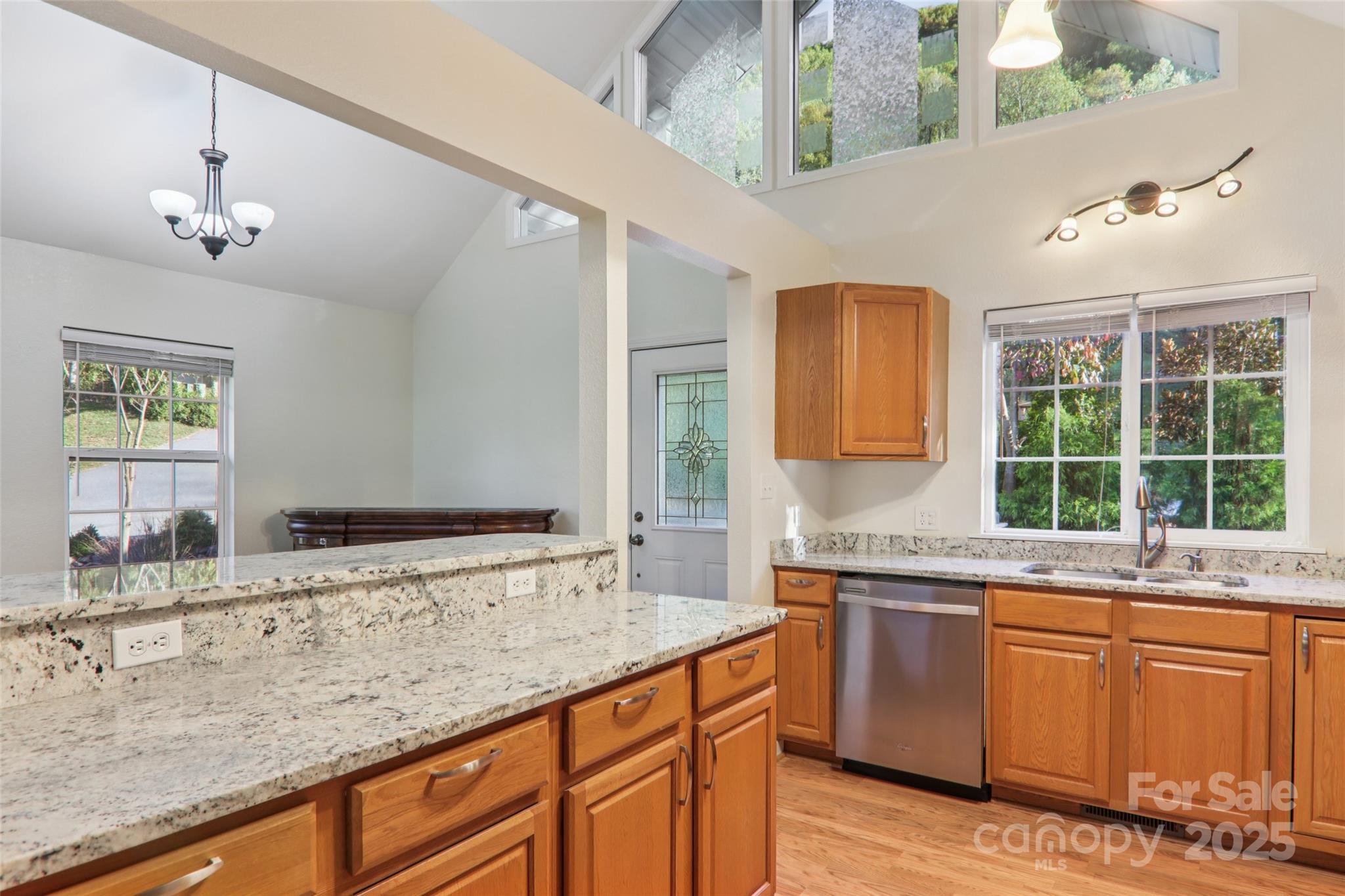 166 Linsonwood Ridge Waynesville, NC 28786 - Photo 13 of 39 a bathroom with a granite countertop sink and a large mirror