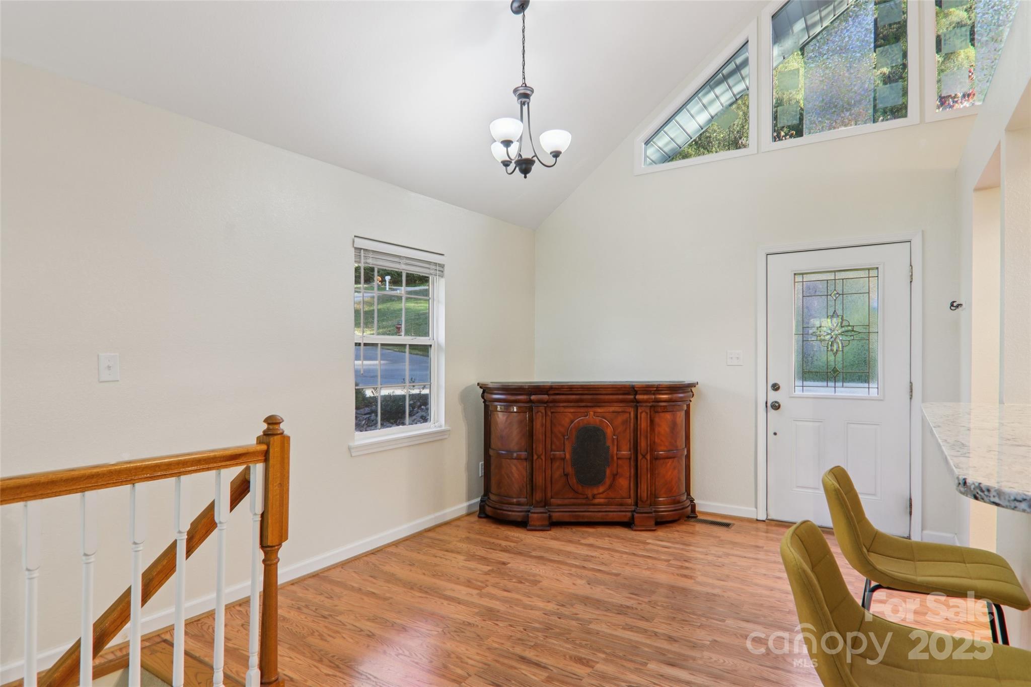 166 Linsonwood Ridge Waynesville, NC 28786 - Photo 15 of 39 a view of an empty room with wooden floor and a window