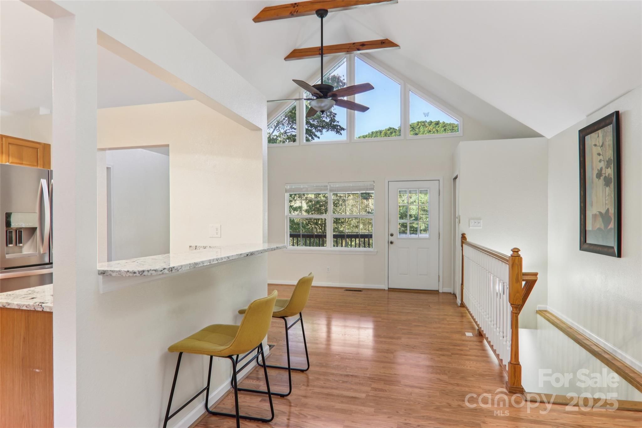 166 Linsonwood Ridge Waynesville, NC 28786 - Photo 16 of 39 a view of a dining room with furniture window and wooden floor