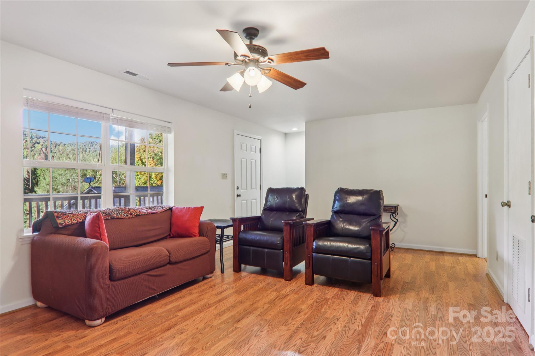 166 Linsonwood Ridge Waynesville, NC 28786 - Photo 20 of 39 a living room with furniture and a large window