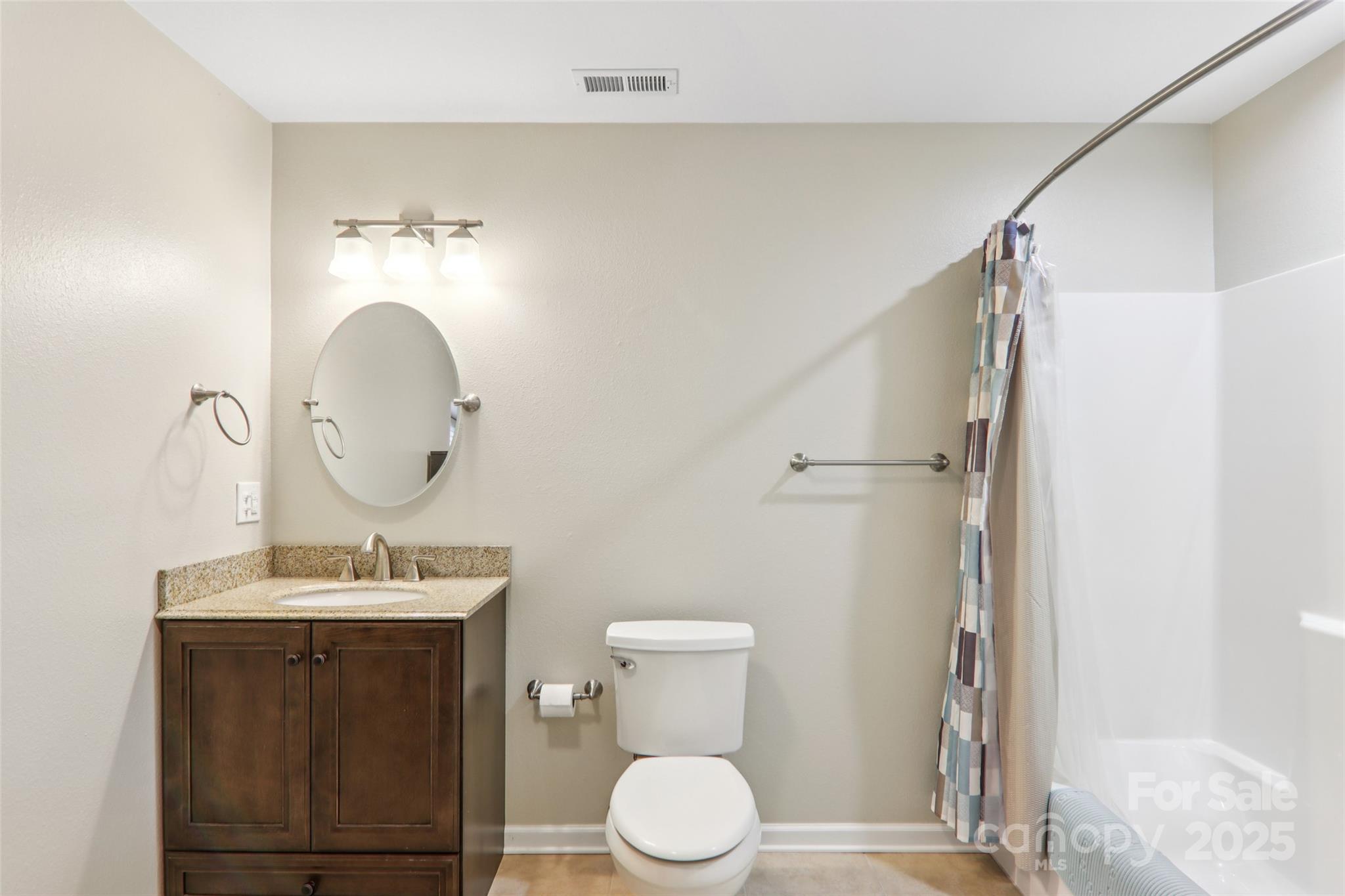 166 Linsonwood Ridge Waynesville, NC 28786 - Photo 27 of 39 a bathroom with a toilet a sink and a mirror