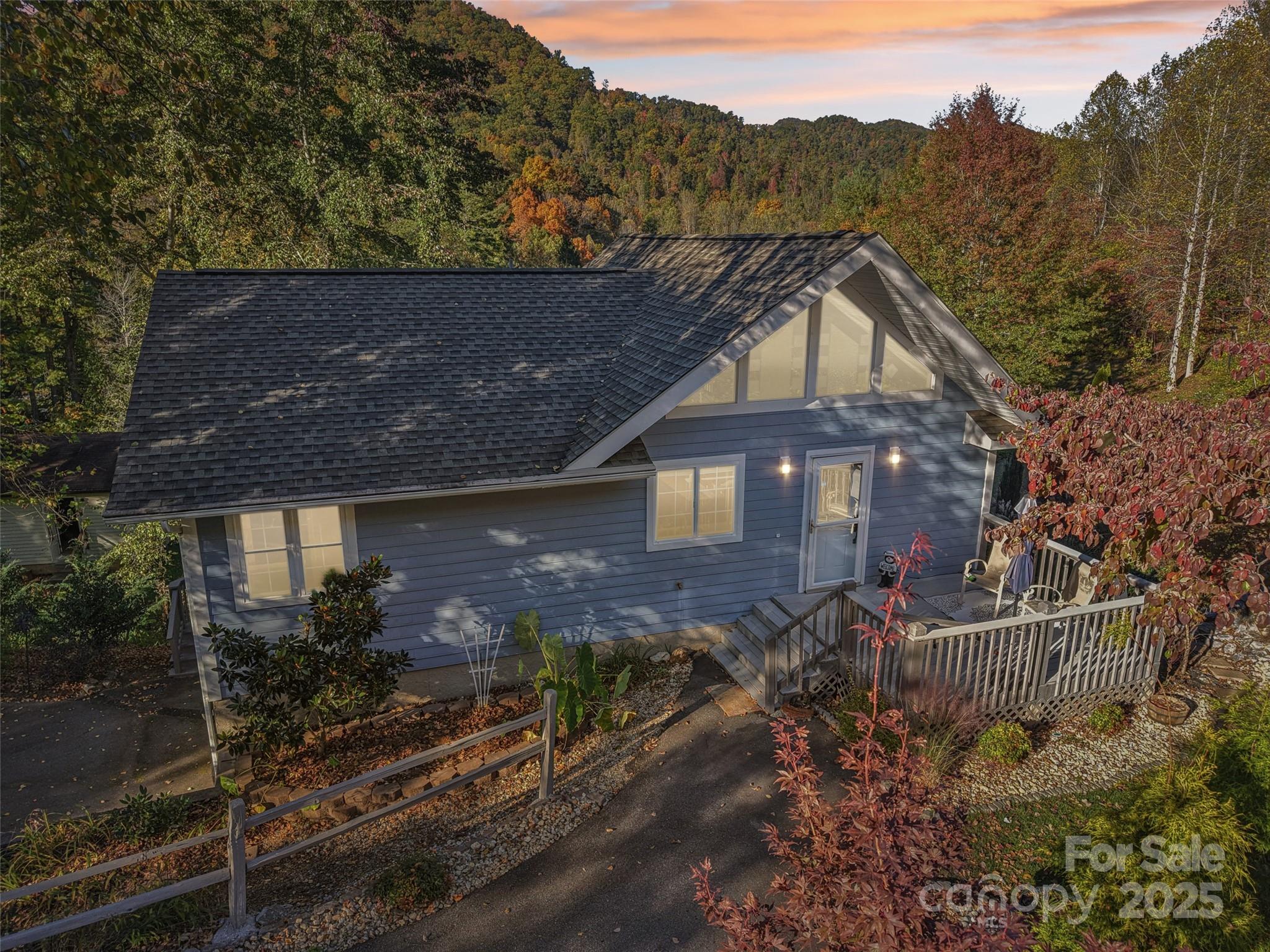 166 Linsonwood Ridge Waynesville, NC 28786 - Photo 3 of 39 a view of a house with a yard