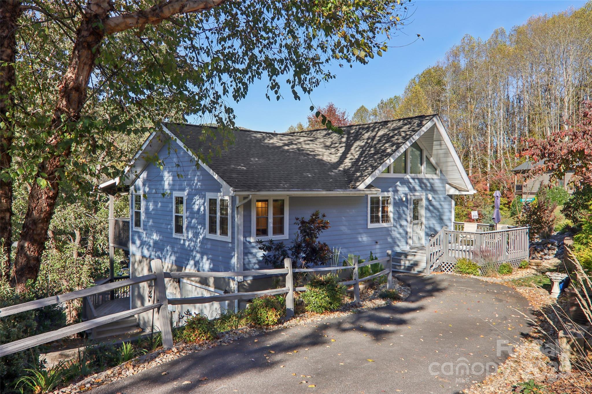166 Linsonwood Ridge Waynesville, NC 28786 - Photo 4 of 39 a front view of a house with garden