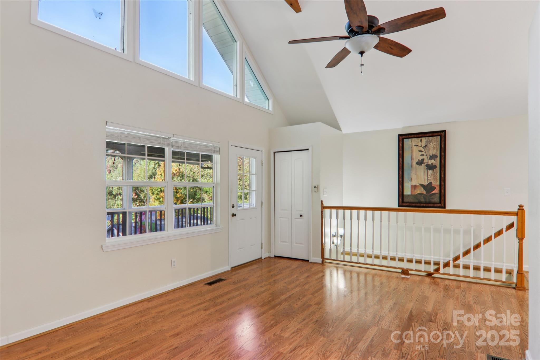 166 Linsonwood Ridge Waynesville, NC 28786 - Photo 6 of 39 a view of an empty room with wooden floor and a window
