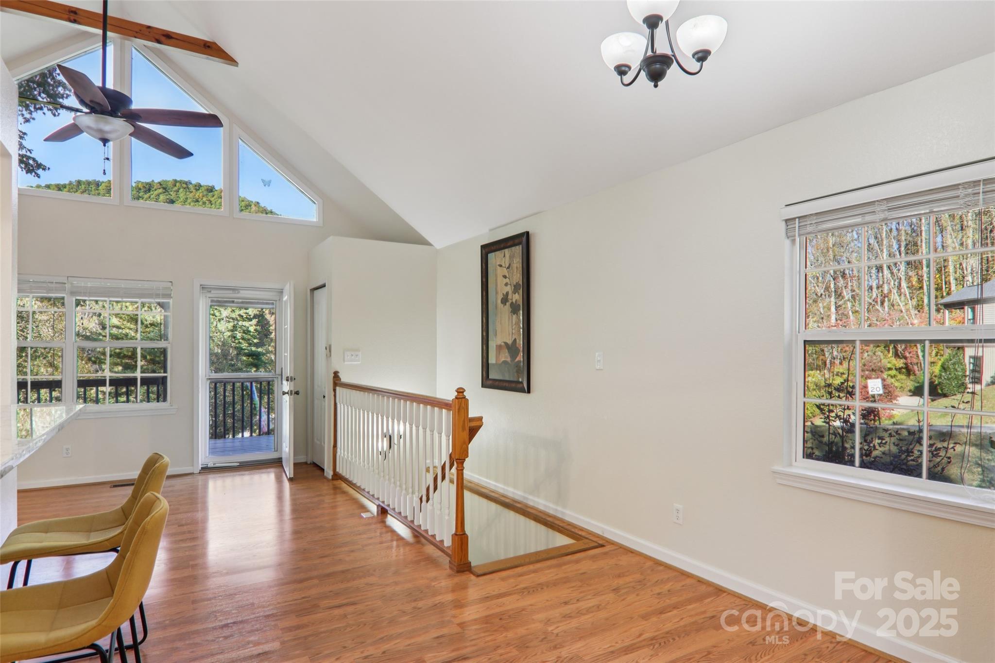 166 Linsonwood Ridge Waynesville, NC 28786 - Photo 8 of 39 a view of an empty room with wooden floor and a window