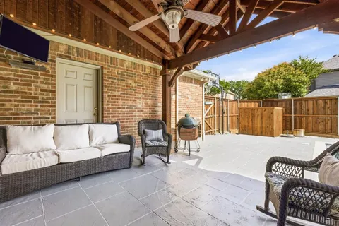 a balcony with furniture and a potted plant