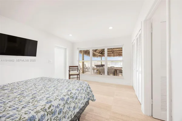 a bathroom with a double vanity sink toilet and shower