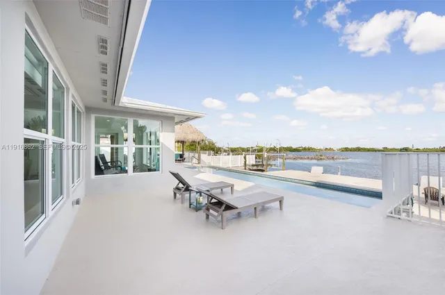 a view of a patio with couches and chairs