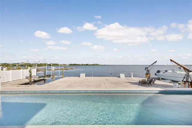 an aerial view of a house with a ocean view