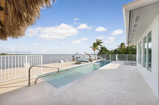 an aerial view of a house with garden space and street view