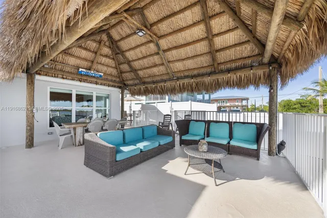 an aerial view of a house with a yard and fountain