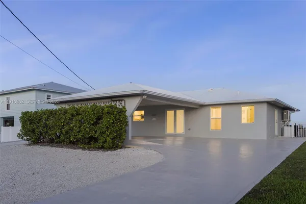 a view of a big room with pool table and chairs