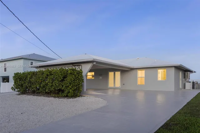 a view of a big room with pool table and chairs
