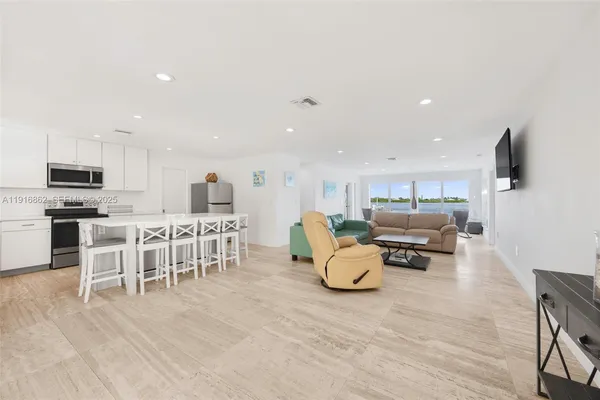 a kitchen with a sink stove top oven and cabinets
