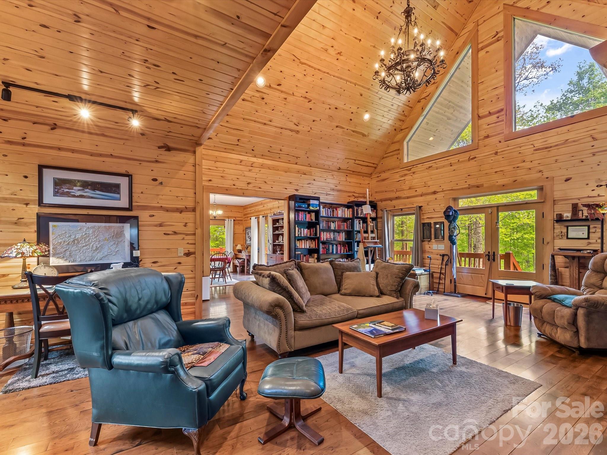 917 Otter Mountain Road Topton, NC 28781 - Photo 11 of 48 a living room with furniture a couch and a bookshelf